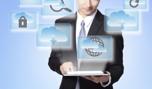 Cloud computing concept - Business man touch tablet pc with cloud computing icon in the air